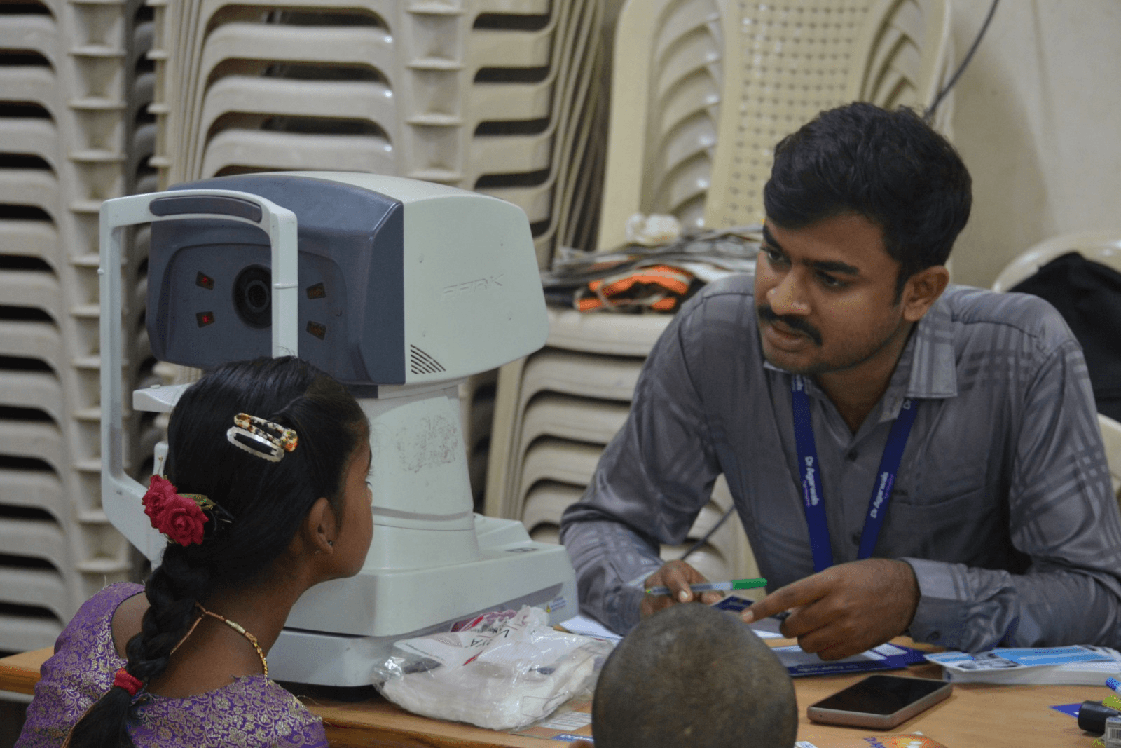 Child receiving an eye screening during the medical camp