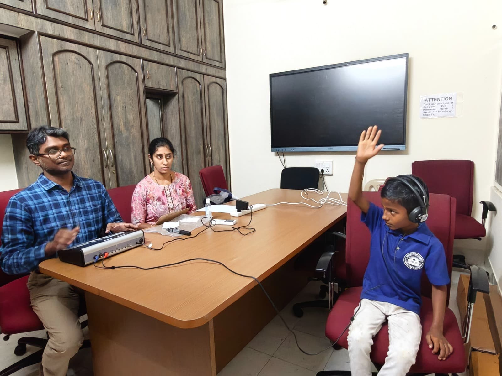 Child taking part in a hearing evaluation with Bharath Audiology clinicians